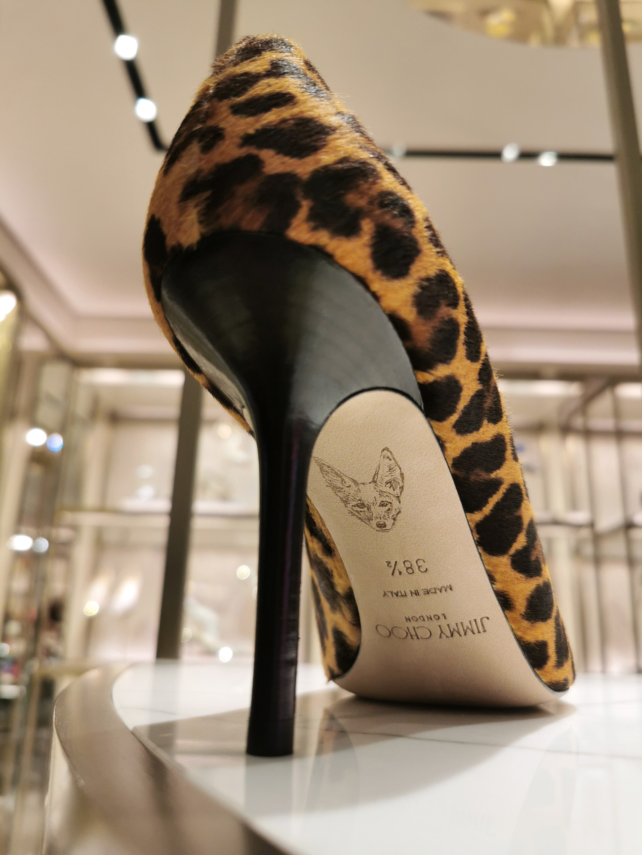 Art hand painted live under the Jimmy Choo shoe during a special event
