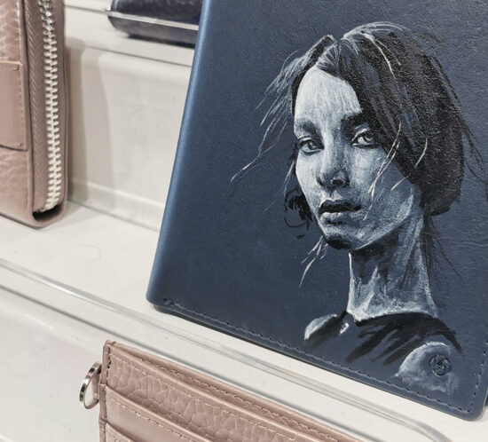 Portrait painted on a leather wallet